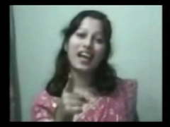 an indian lady taking her bath outside